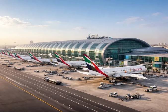 Dubai International Airport expansion — aerial view of Terminal 3 and Emirates aircraft stands, UAE